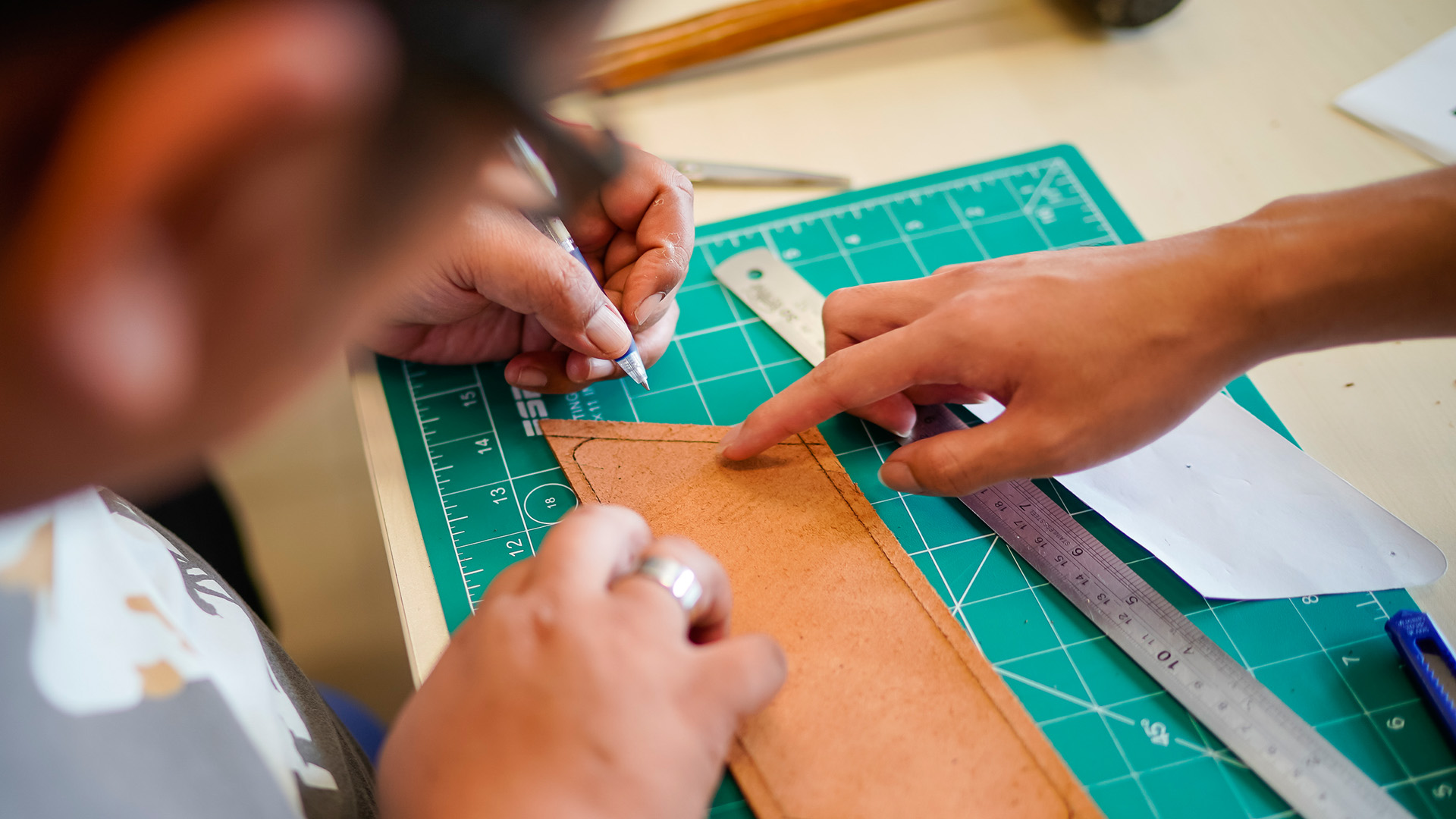 Team of Designers Measuring a Wood